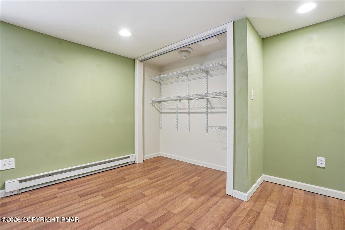 401 Clearview Drive Long Pond, PA 18334 - Photo 33 of 77 an empty room with wooden floor and closet