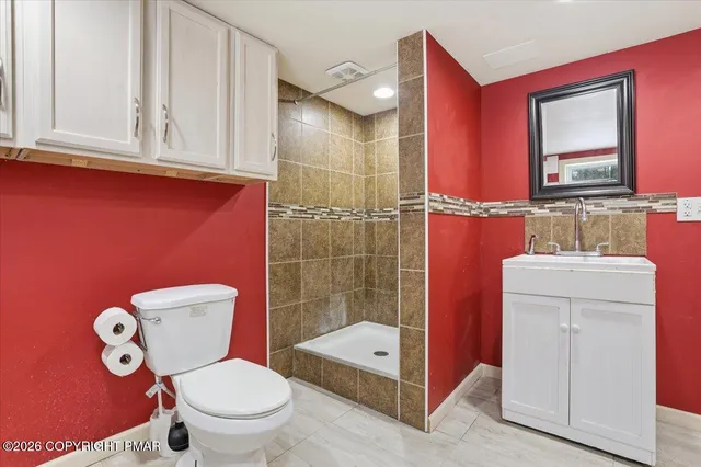 a view of a house with a yard covered in snow