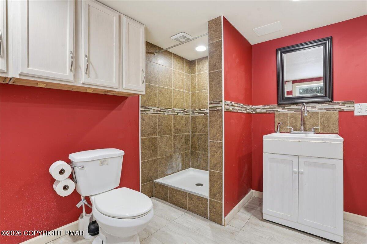 401 Clearview Drive Long Pond, PA 18334 - Photo 34 of 77 a bathroom with a toilet a sink and mirror