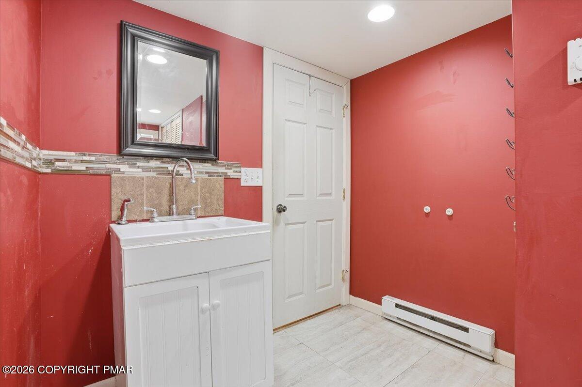 401 Clearview Drive Long Pond, PA 18334 - Photo 35 of 77 a bathroom with a sink and a mirror