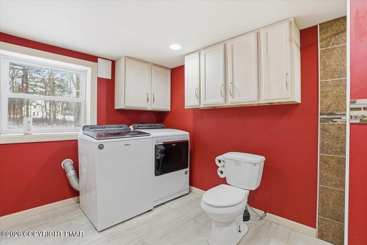 401 Clearview Drive Long Pond, PA 18334 - Photo 41 of 77 a bathroom with a toilet a sink and a window