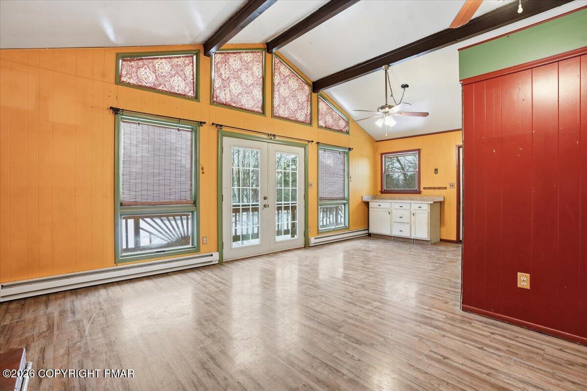 401 Clearview Drive Long Pond, PA 18334 - Photo 9 of 77 an empty room with wooden floor and windows