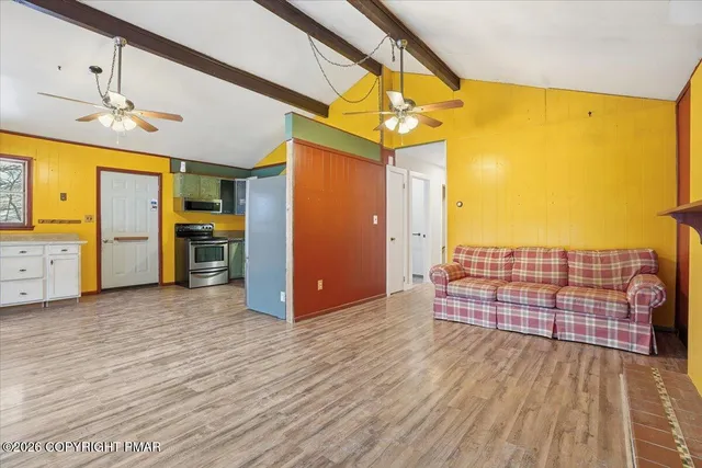 a kitchen with stove and cabinets
