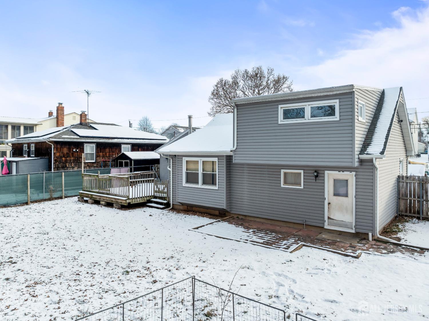 70 Central Avenue Sewaren, NJ 07064 - Photo 2 of 22 a backyard of a house with wooden fence