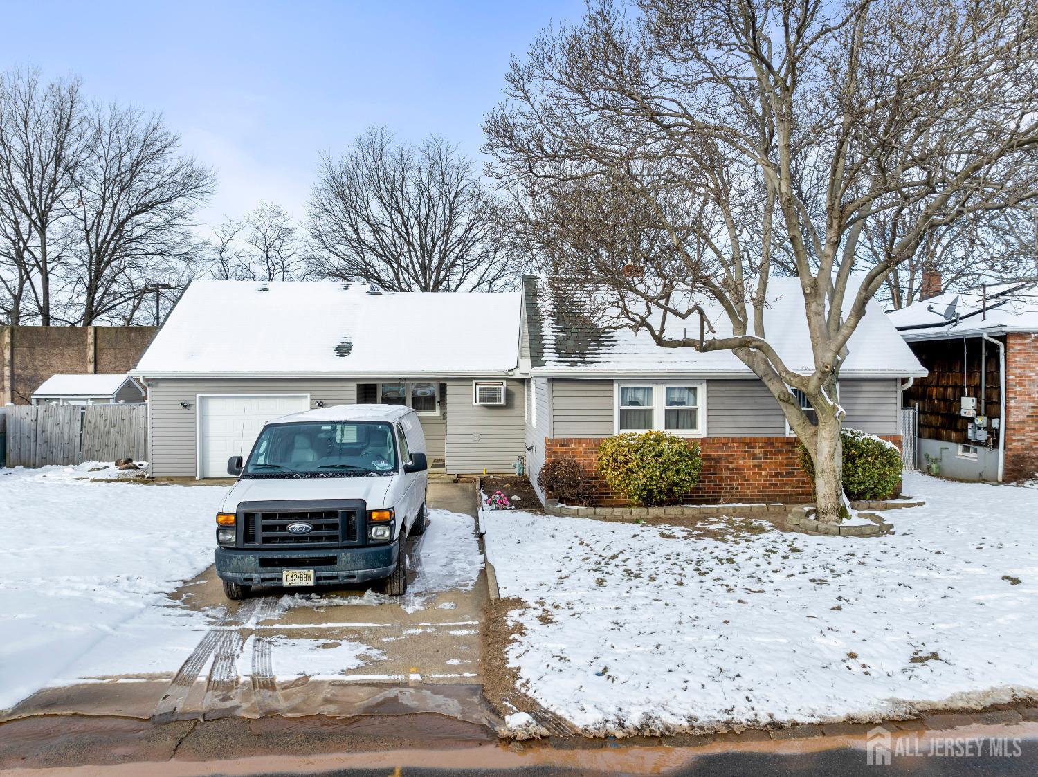 70 Central Avenue Sewaren, NJ 07064 - Photo 7 of 22 a car parked in front of white house