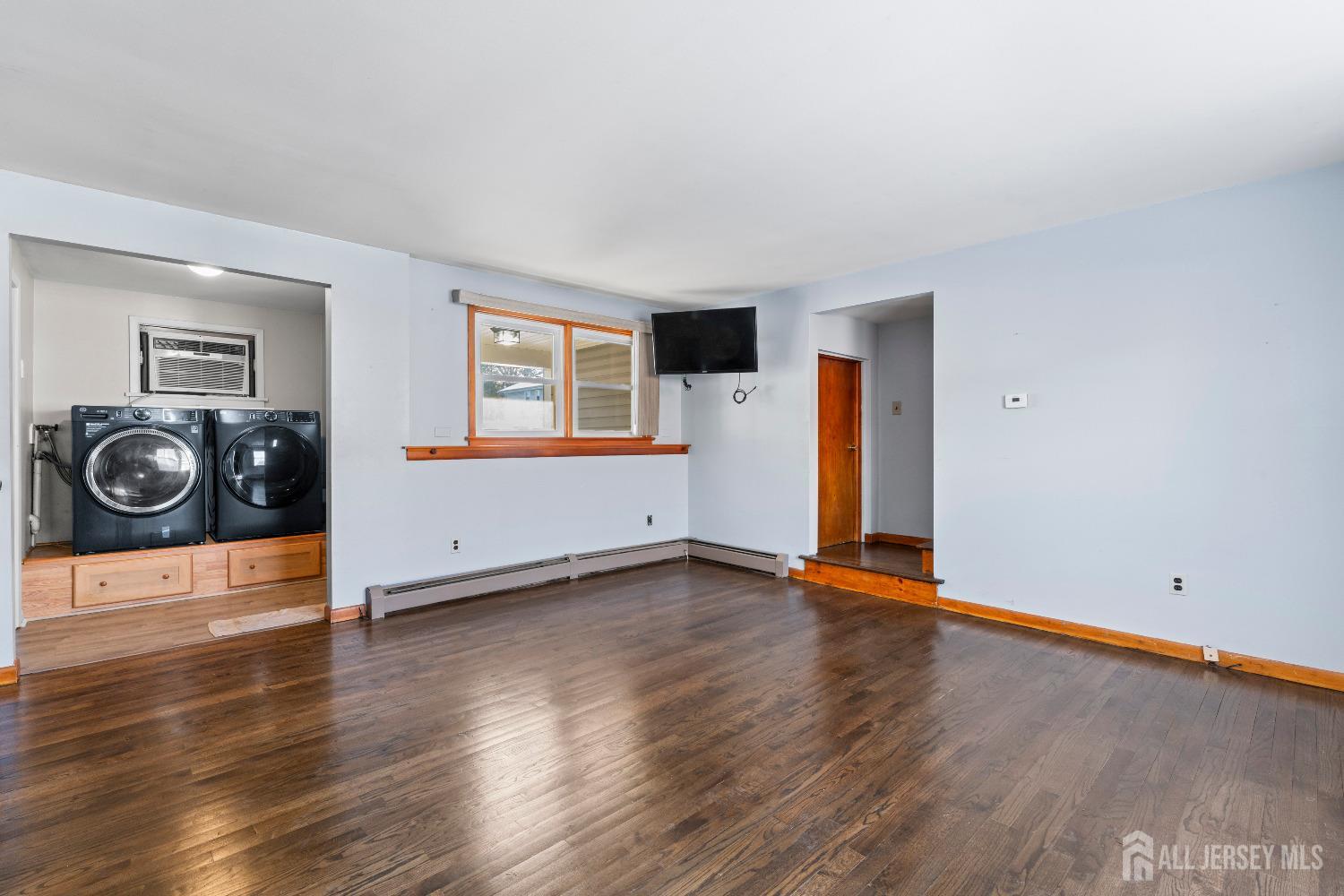 70 Central Avenue Sewaren, NJ 07064 - Photo 9 of 22 a view of a livingroom with wooden floor