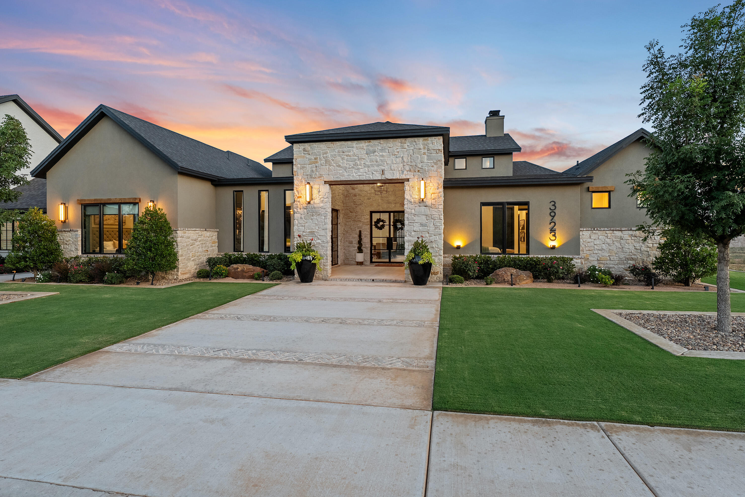 a front view of house with yard and green space