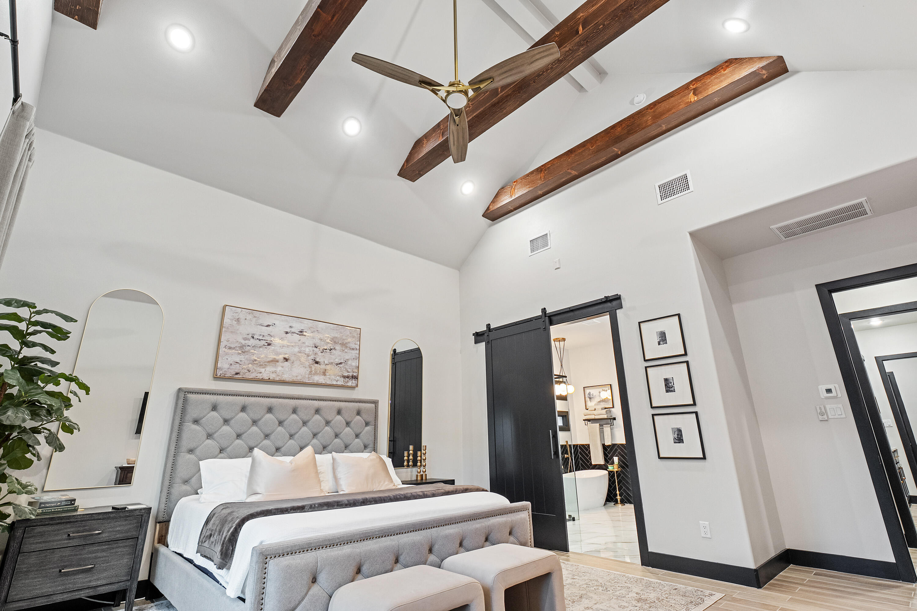 3923 149th Street Lubbock, TX 79423 - Photo 20 of 57 a bedroom with a bed and a chandelier