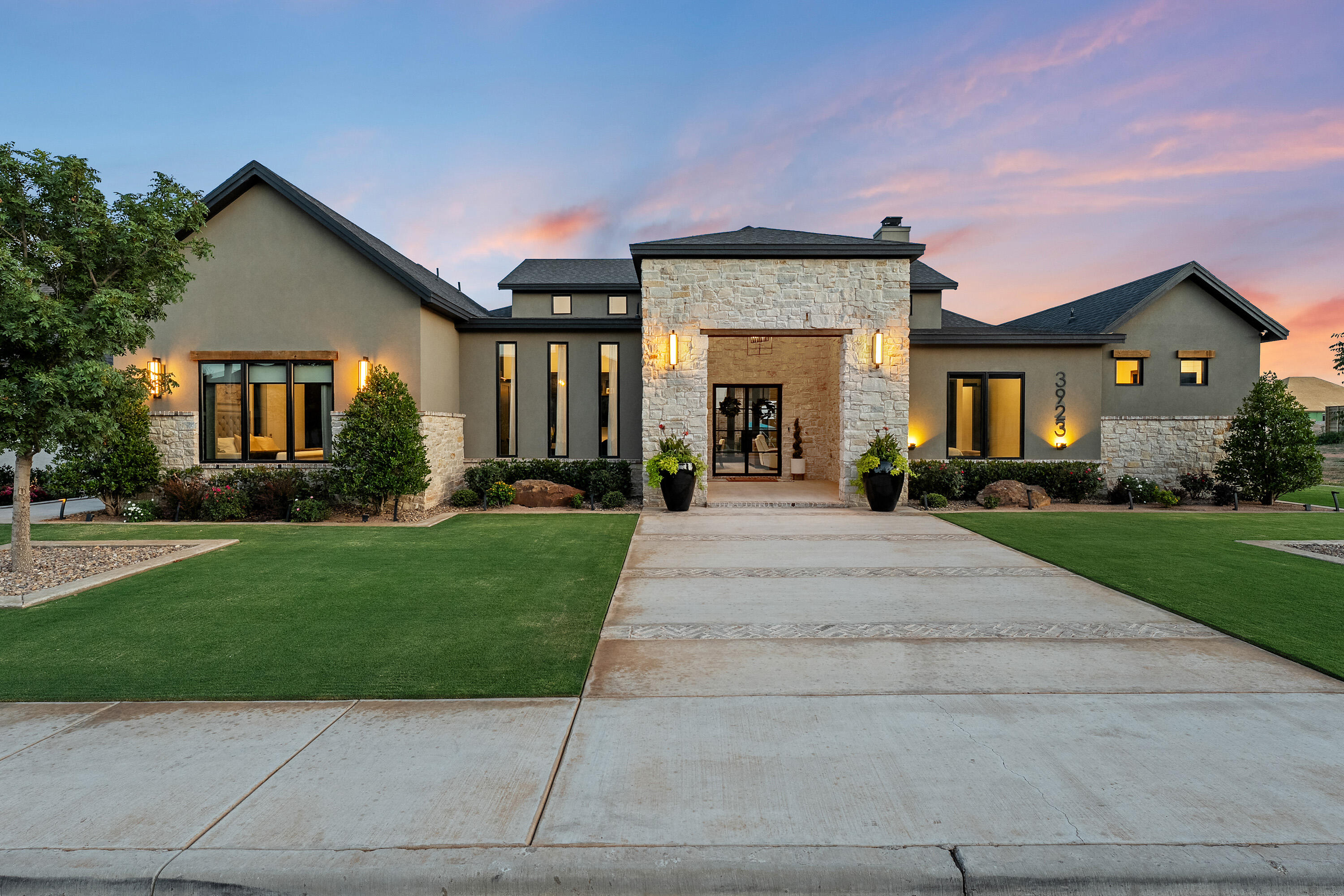 3923 149th Street Lubbock, TX 79423 - Photo 2 of 57 a front view of a house with a yard and trees