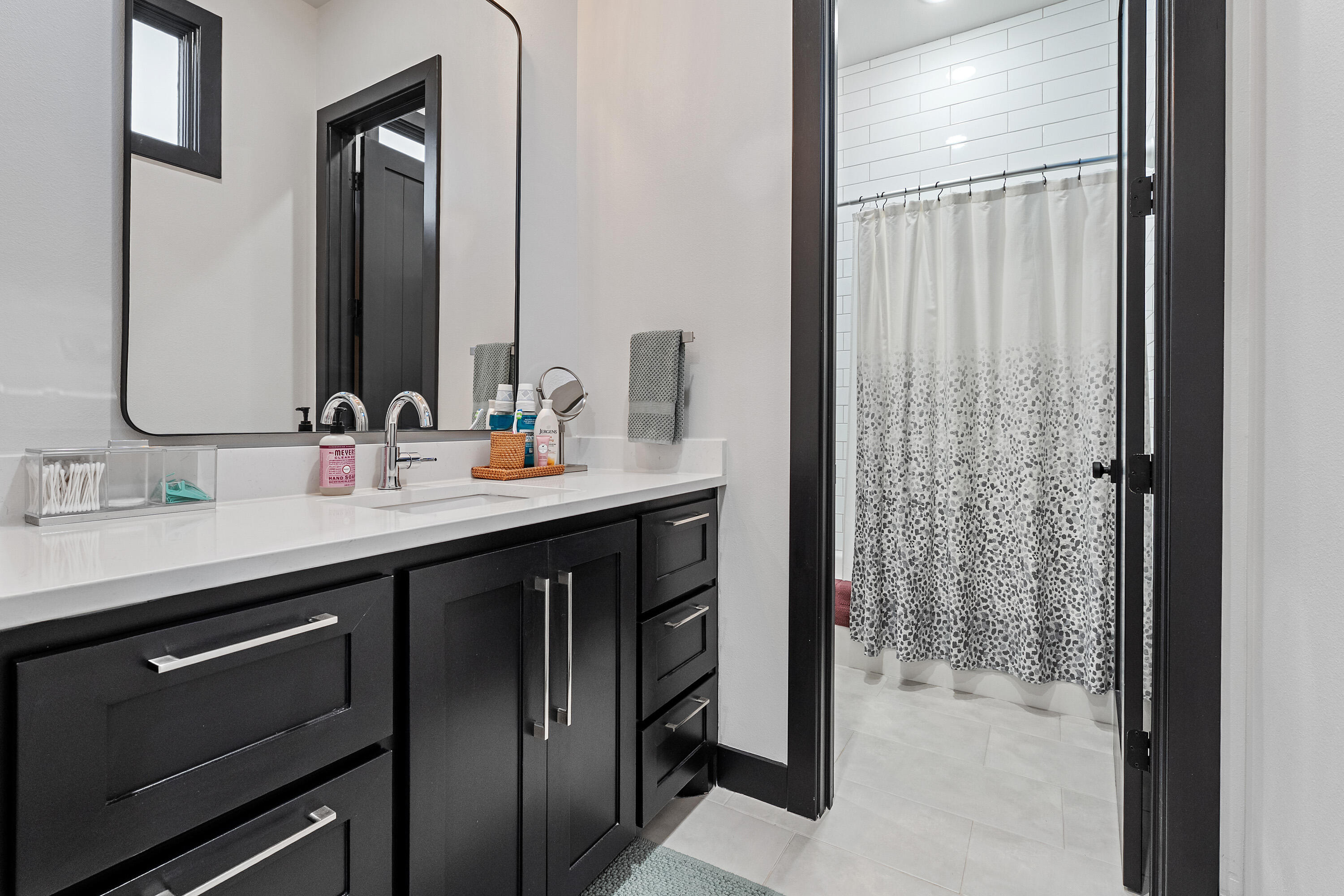 3923 149th Street Lubbock, TX 79423 - Photo 31 of 57 a bathroom with a sink double vanity and a mirror