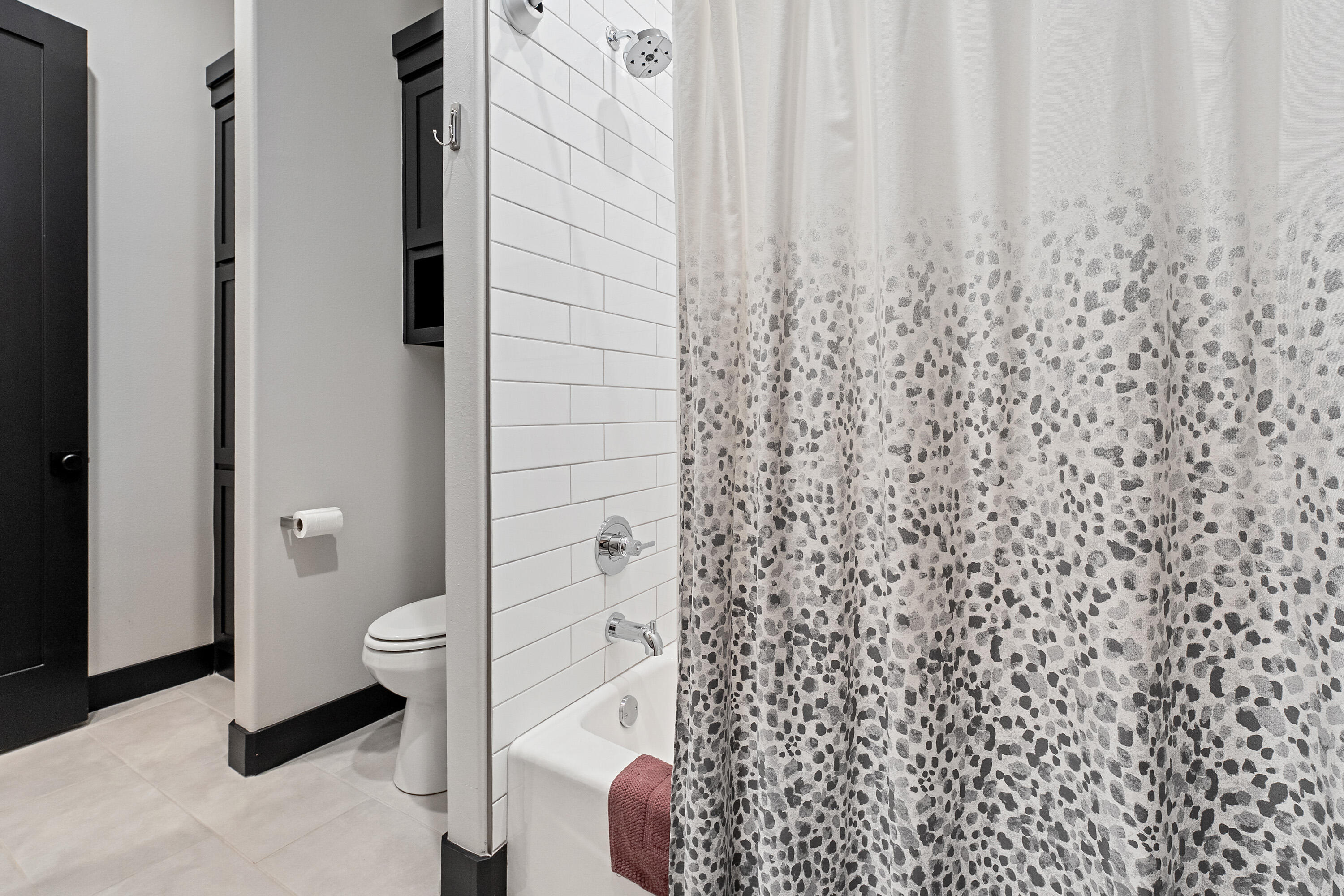 3923 149th Street Lubbock, TX 79423 - Photo 32 of 57 a bathroom with a shower curtain