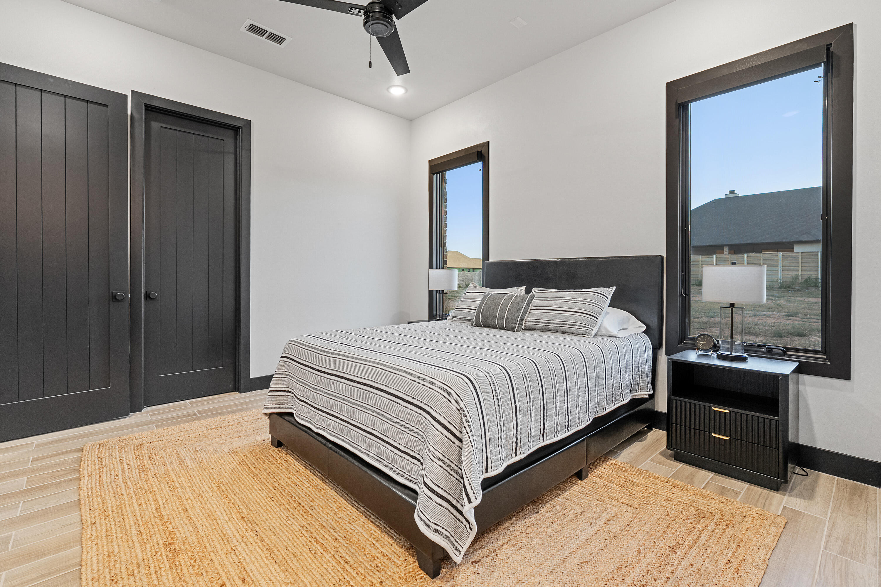 3923 149th Street Lubbock, TX 79423 - Photo 33 of 57 a bedroom with a bed and large window
