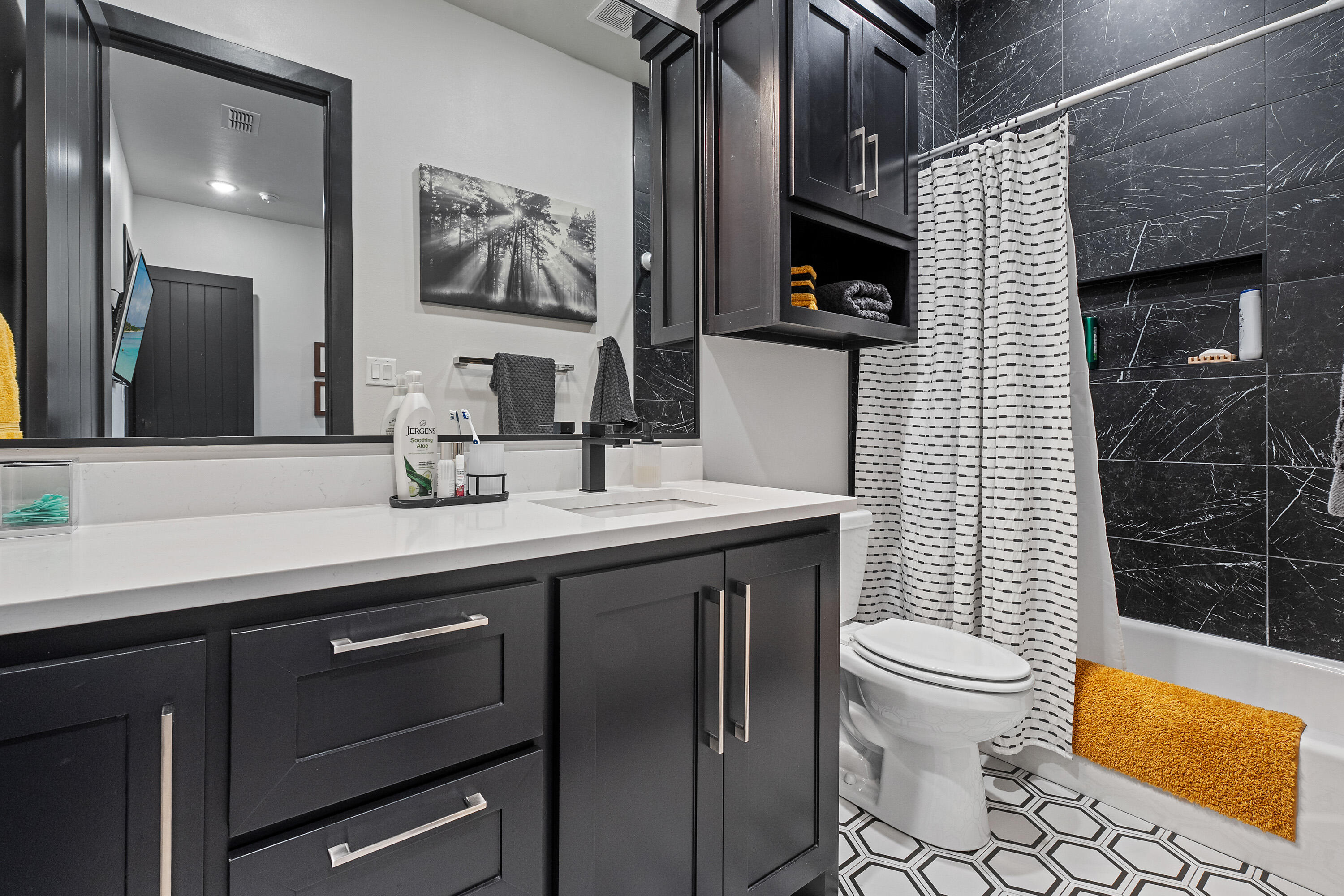 3923 149th Street Lubbock, TX 79423 - Photo 35 of 57 a bathroom with a sink a toilet and shower
