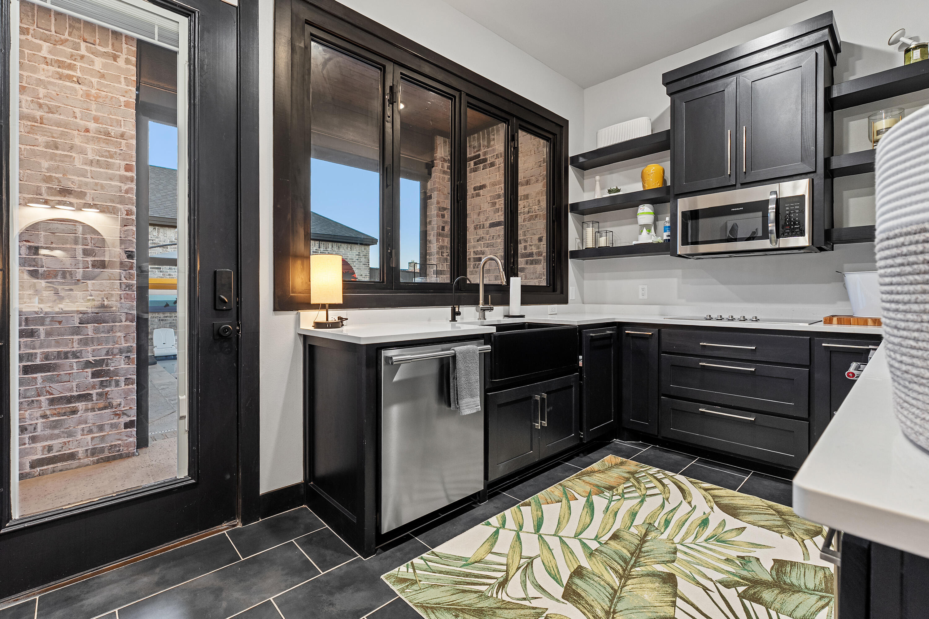 3923 149th Street Lubbock, TX 79423 - Photo 52 of 57 a kitchen with stainless steel appliances granite countertop a stove and a sink