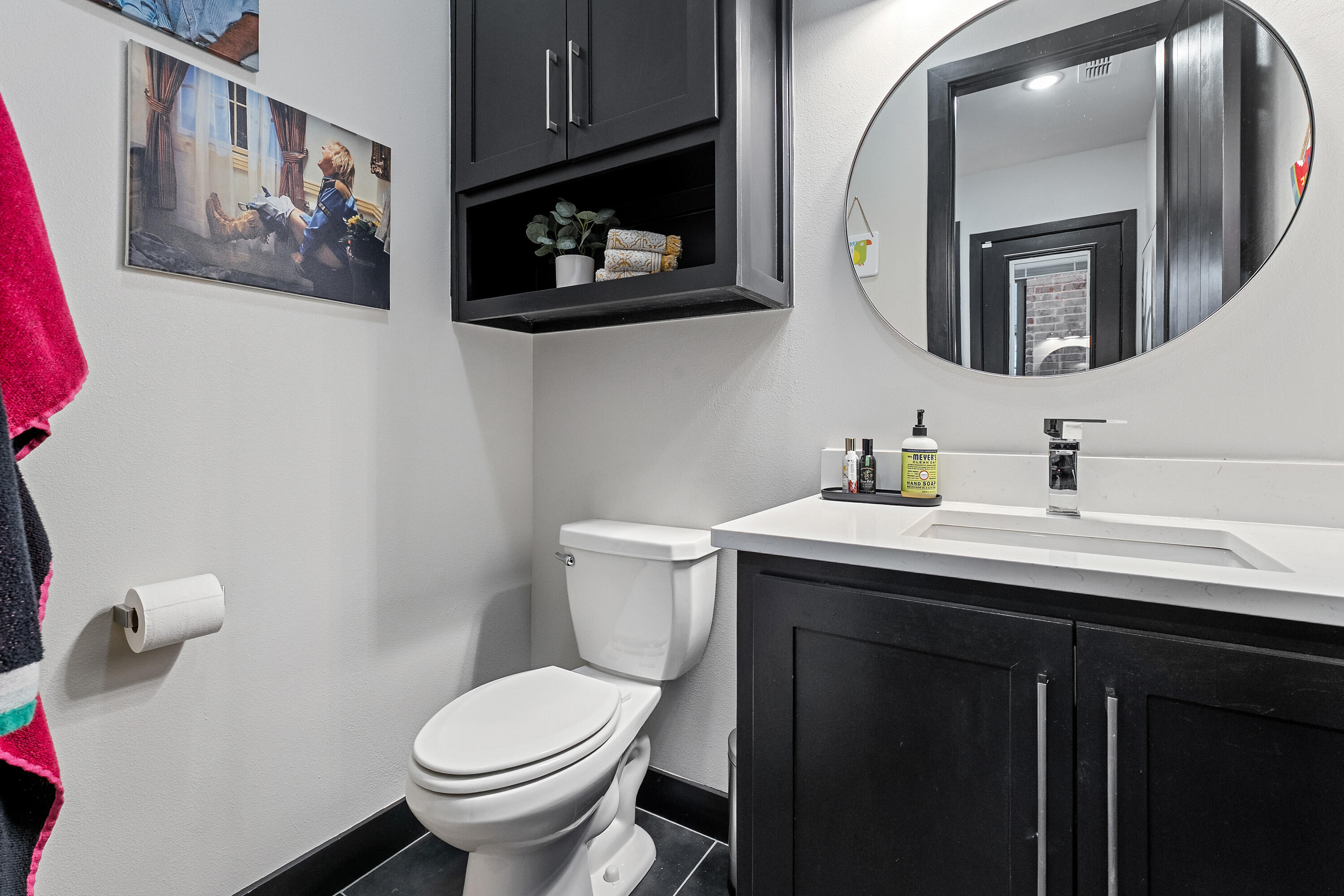 3923 149th Street Lubbock, TX 79423 - Photo 55 of 57 a bathroom with a toilet sink and mirror