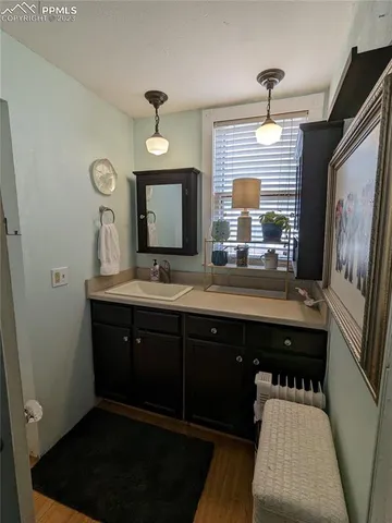 a bathroom with a sink double vanity granite and a mirror