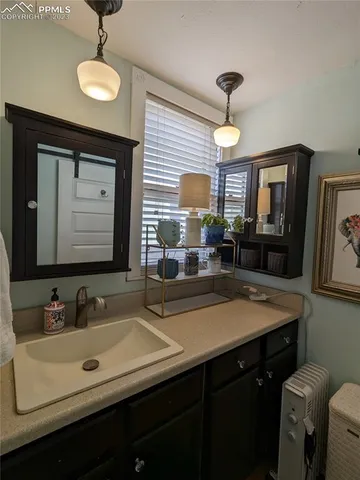 a bathroom with a sink double vanity and a mirror