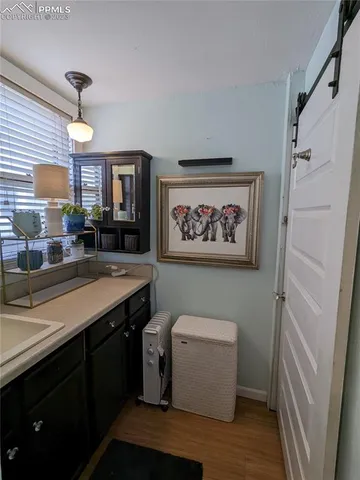 a view of a room with painting on the wall