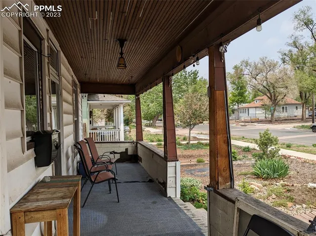 a view of a wooden fence and trees