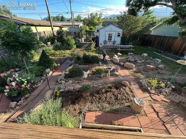 a living room with a fireplace furniture and a flat screen tv