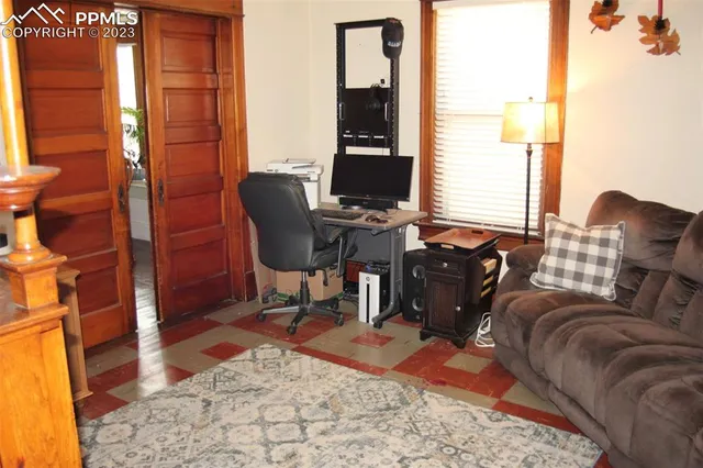 a room with a window and wooden floor