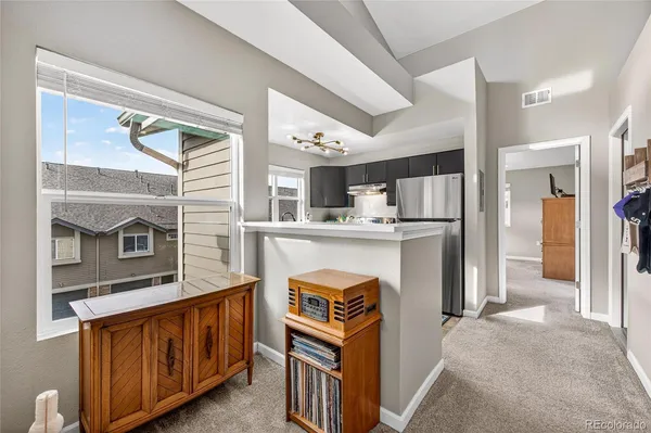 a kitchen with stainless steel appliances granite countertop a stove and a refrigerator