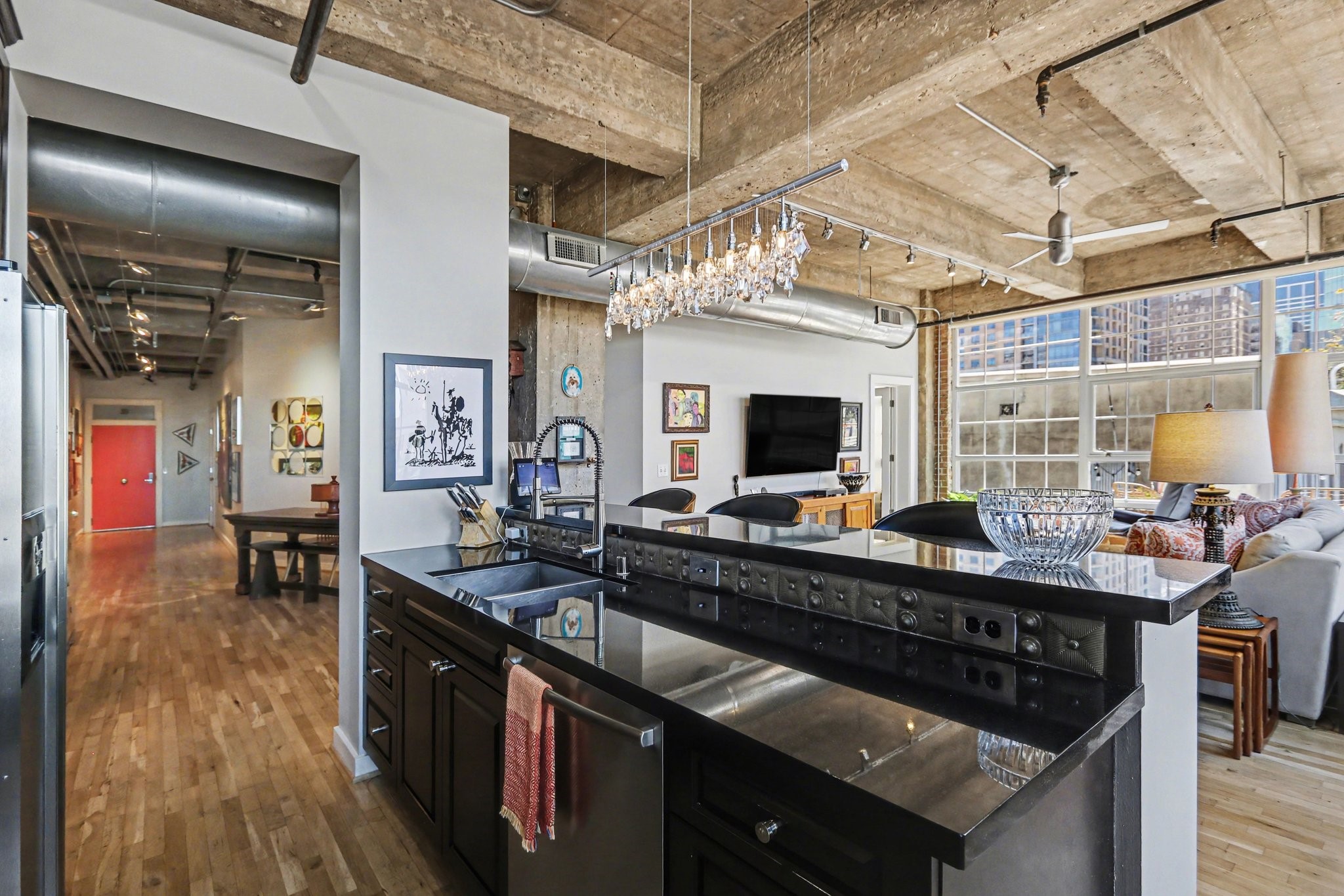 204 Travis Street, Unit 4E Houston, TX 77002 - Photo 8 of 29 a kitchen with a sink stove and cabinets