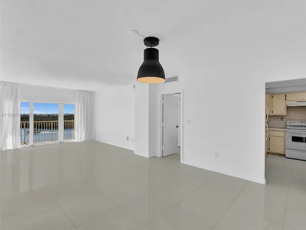 a view of an empty room with a window