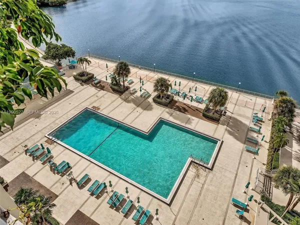 a sign broad in front of flowers