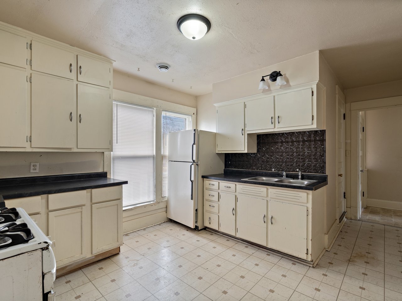 1546 12th Avenue Moline, IL 61265 - Photo 30 of 32 a kitchen with white cabinets and appliances