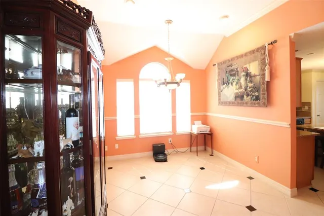 a bathroom with a sink mirror and a shower