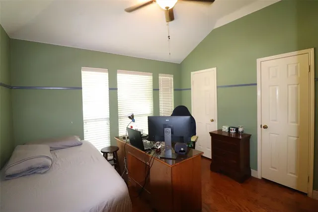 a bedroom with furniture and a window