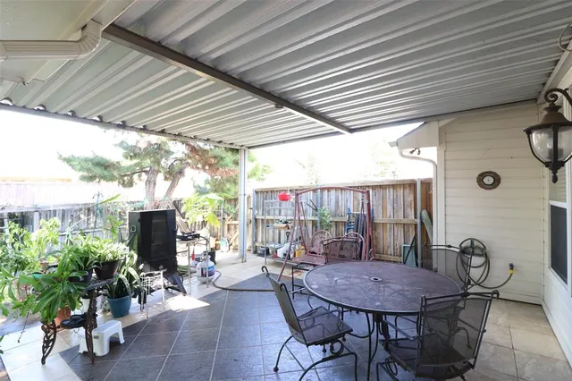 a view of a patio filled with furniture