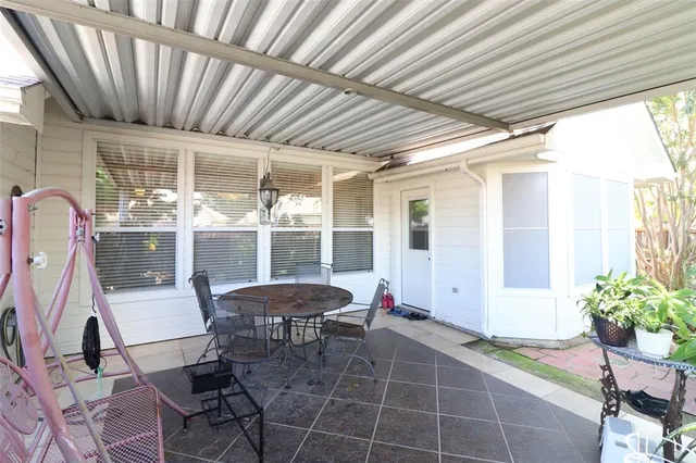 a view of a dining room with furniture wooden floor and a chandelier