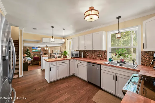 a bathroom with a granite countertop sink a toilet a mirror and shower