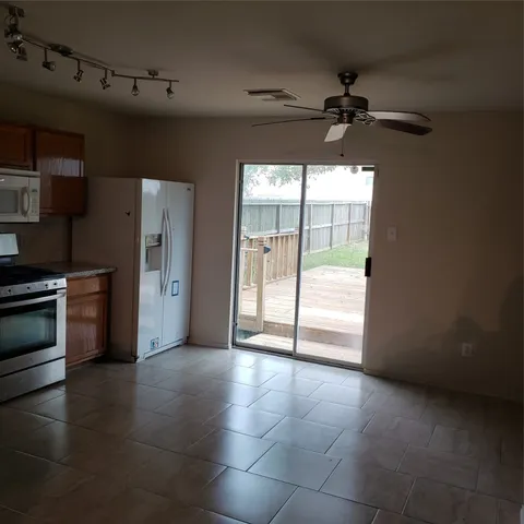 a view of an empty room and a window