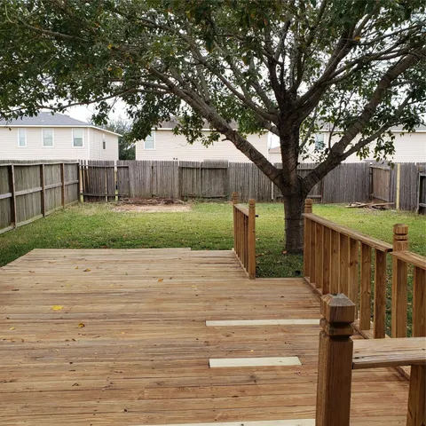 a view of a deck and yard