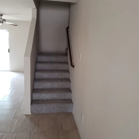 a view of staircase with white walls