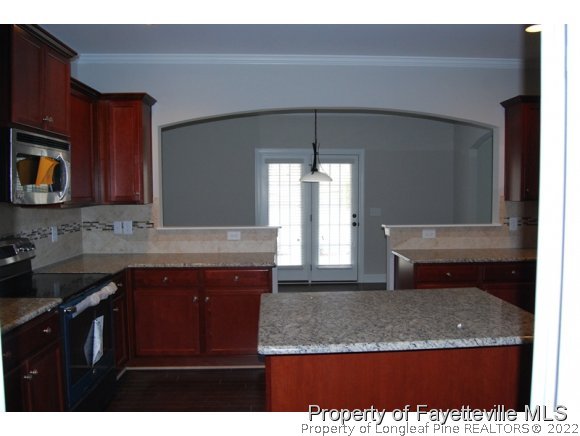 1024 Micahs Way North Spring Lake, NC 28390 - Photo 12 of 25 a kitchen with a sink and cabinets