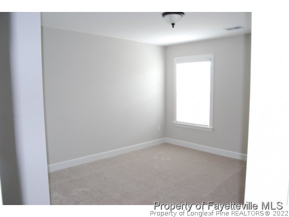1024 Micahs Way North Spring Lake, NC 28390 - Photo 21 of 25 a view of an empty room with a window