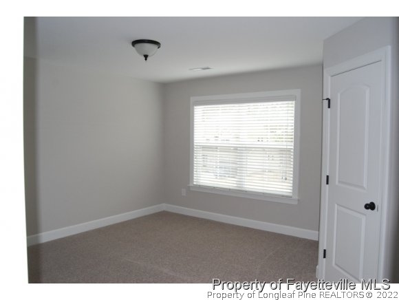 1024 Micahs Way North Spring Lake, NC 28390 - Photo 22 of 25 a view of an empty room with a window