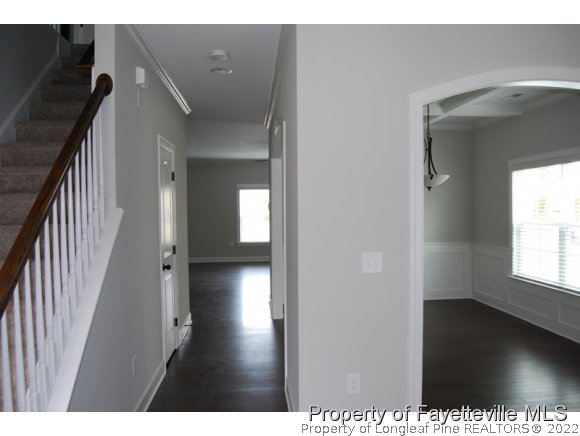 1024 Micahs Way North Spring Lake, NC 28390 - Photo 4 of 25 a view of a hallway view with wooden floor and staircase