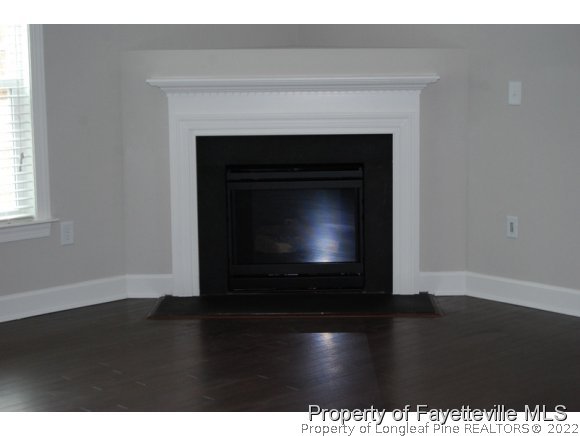 1024 Micahs Way North Spring Lake, NC 28390 - Photo 8 of 25 a living room with a fireplace