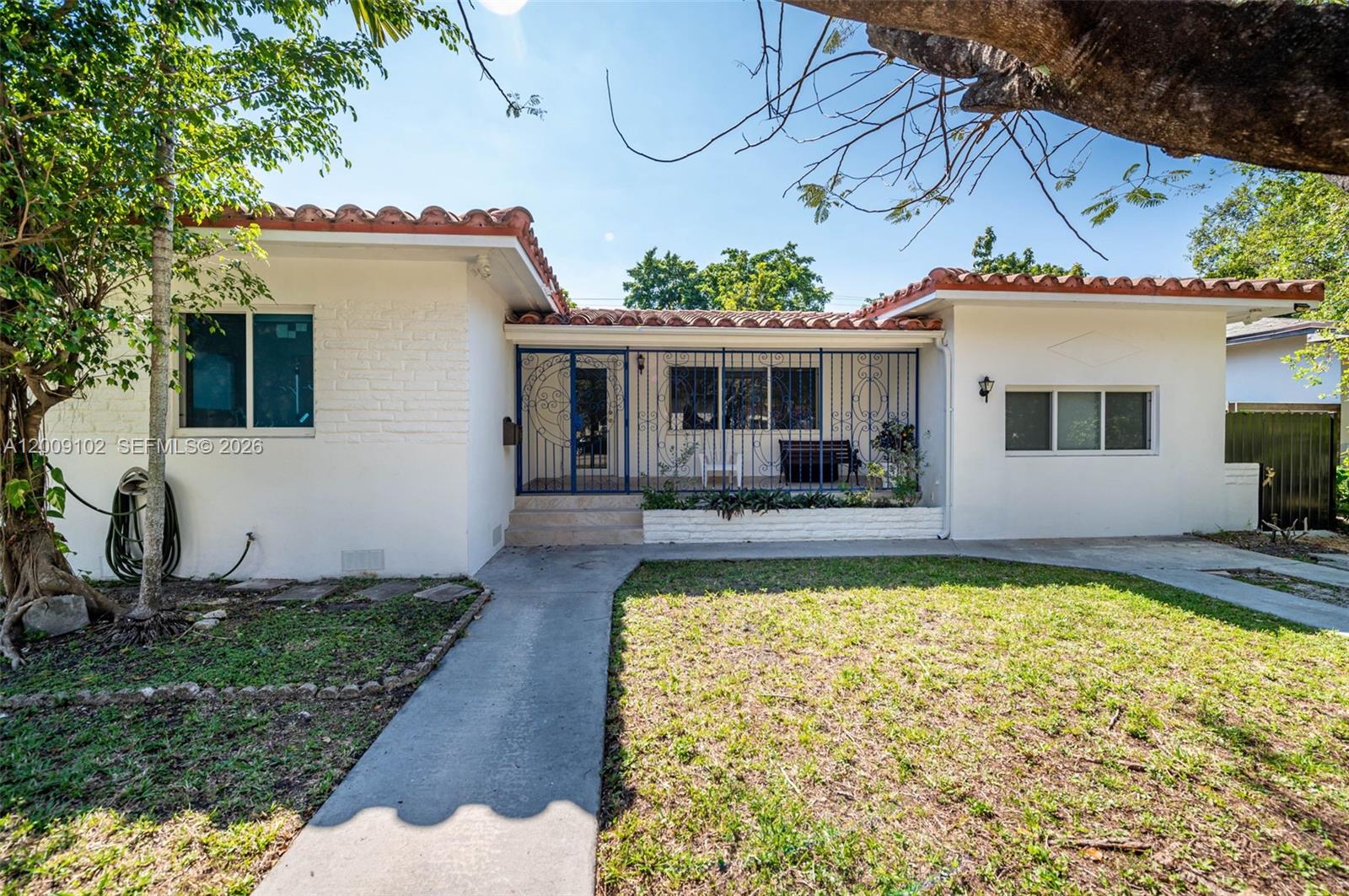 330 Southwest 27th Road Miami, FL 33129 - Photo 40 of 62 a view of a house with swimming pool and a porch