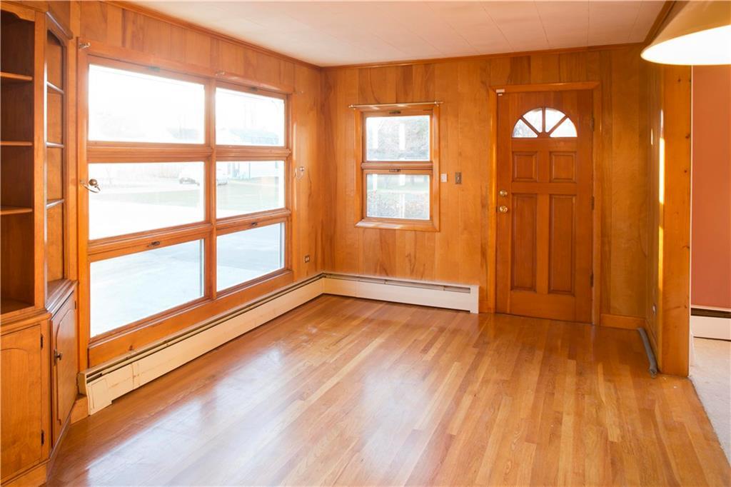 15 Call Road Milford, ME 04461 - Photo 3 of 27 Front door opens into bright den