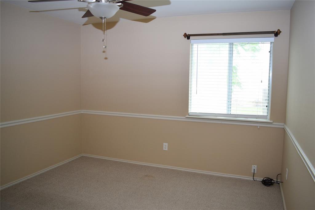 3688 Spring Canyon Trail Round Rock, TX 78681 - Photo 15 of 17 Room featuring a ceiling fan, window with blinds, and two-tone painted walls with chair rail molding