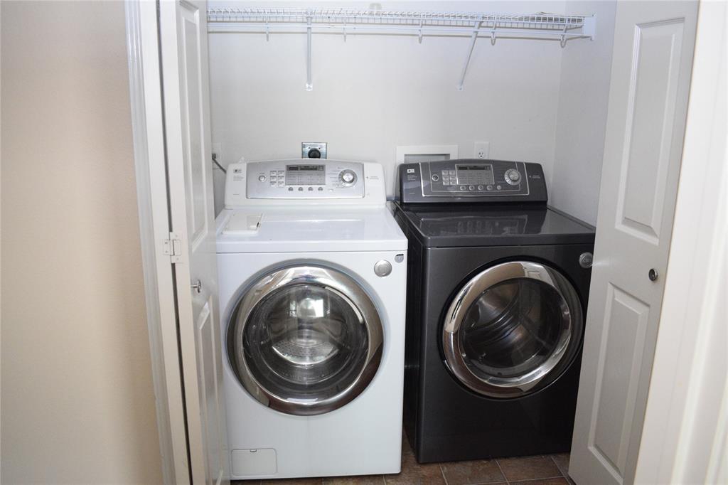 3688 Spring Canyon Trail Round Rock, TX 78681 - Photo 17 of 17 Dedicated laundry closet with bi-fold doors, overhead wire shelving, and durable flooring