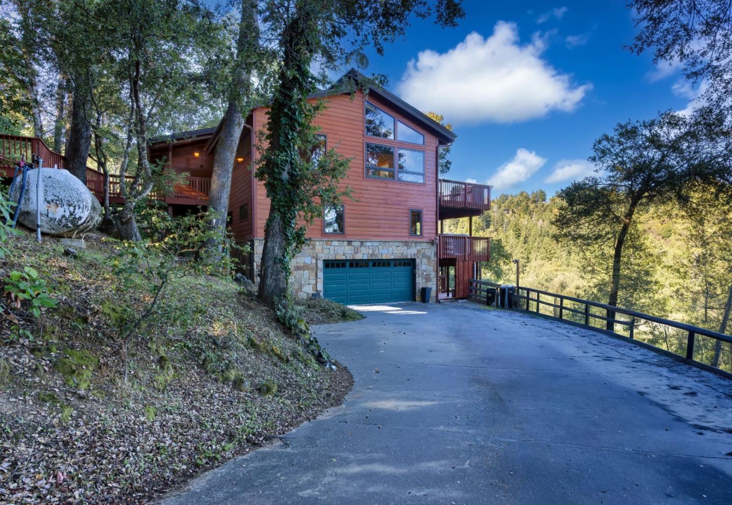 22125 Miller Ridge Road Los Gatos, CA 95033 - Photo 11 of 35 a view of a house with a yard and potted plants