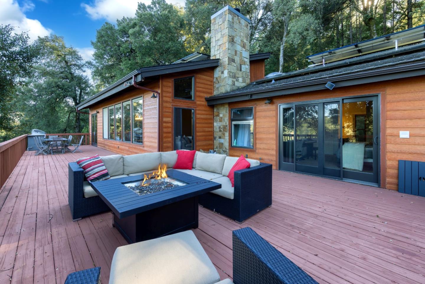 22125 Miller Ridge Road Los Gatos, CA 95033 - Photo 16 of 35 a outdoor living space with furniture and wooden floor