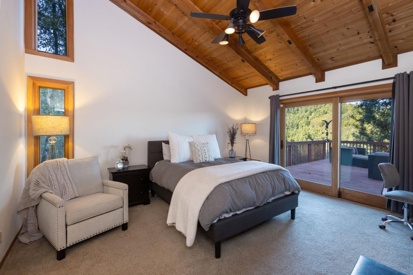 22125 Miller Ridge Road Los Gatos, CA 95033 - Photo 22 of 35 a spacious bedroom with a bed couch and window